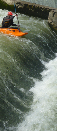 A paddler above a whiet water feature